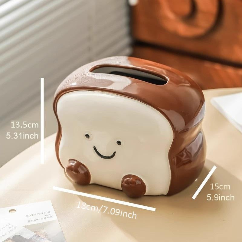 Visually Appealing Toast-Shaped Ceramic Tissue Box Holder – Smiling Bread Design with Pink Flower Detail, White & Brown Accents, Perfect for Living Room, Bedroom, or Kitchen Decor